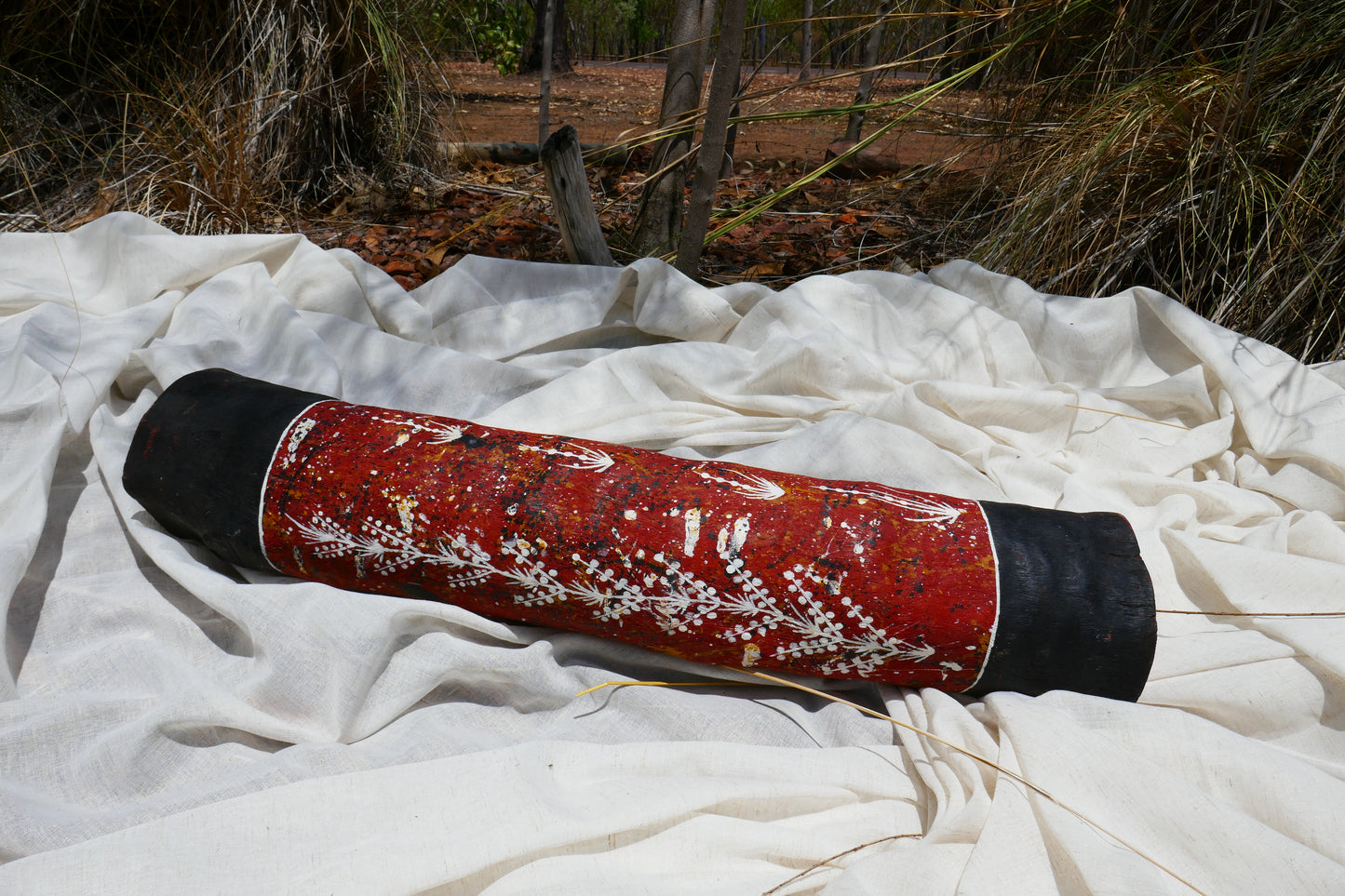Authentic Aboriginal art, wooden carving. This hand-painted Lorrkon is a traditional ceremonial coffin log. The trunk is hollowed out by termites, then collected and painted by Bininj (Indigenous) artists of Kakadu and Arnhem Land, Australia.